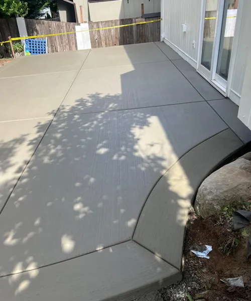 Broom finish patio and decorative borders in Covington 